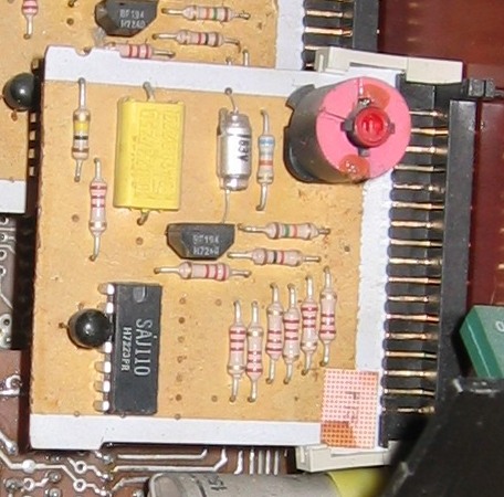 Figure 5 — One GM760 tone-generator board: the pink-capped tuning coil, two BF194 transistors and the SAJ110 divider IC. Photo: Hans Haase, CC BY-SA 3.0, via Wikimedia Commons (https://commons.wi…